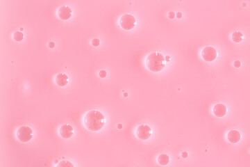 Bubble pink background texture. Berry gel to cleanse the skin of the face and body. Spa treatments, skin care. Bath foam, detergent. Slime pink.