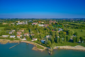 Fototapeta na wymiar Amusement park Gardaland, Italy. Panorama of Lake Garda, Italy. Aerial photography with drone.