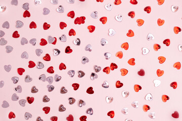 Pattern with red and rose confetti hearts.