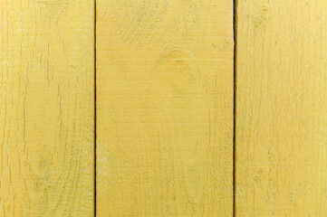 Vertical texture background of light yellow wooden boards