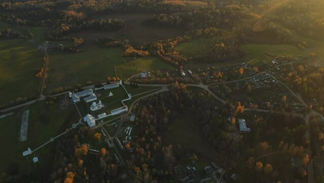Pokrovsko-Tervenichesky monastery of the Leningrad region on the shore of the lake. Video of autumn landscape with a beautiful sunset and an Orthodox convent.
