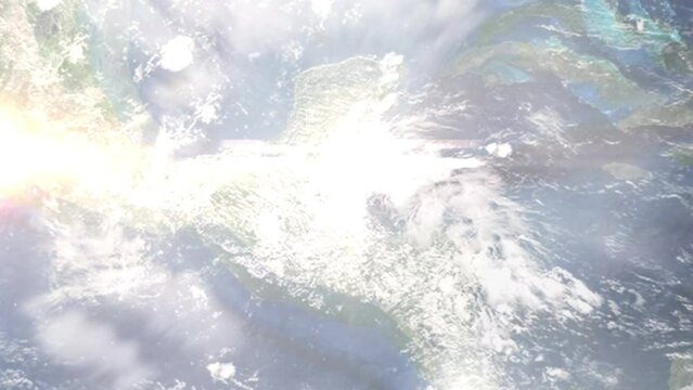Earth zoom in from outer space to city. Zooming on Belmopan, Belize. The animation continues by zoom out through clouds and atmosphere into space. View of the Earth at night. Images from NASA