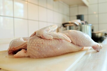 Raw fresh chicken legs on wooden background. Top view. High quality photo