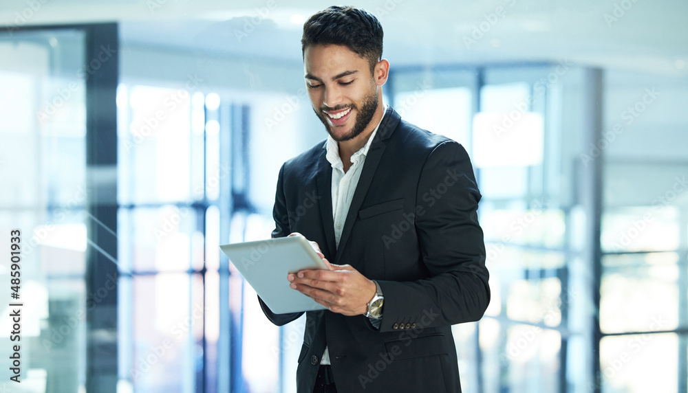Aufkleber having a digital tablet makes life more convenient. shot of a young businessman using a digital tabl