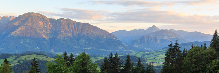 Panorama view with alpine mountains and blue sky in Salzburgerland, Austria