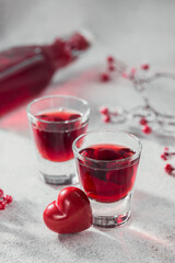 Red cocktail, vodka or liqueur and Heart shape decorations