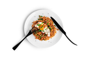 Hot fresh noodles with fried egg isolated on a white background.