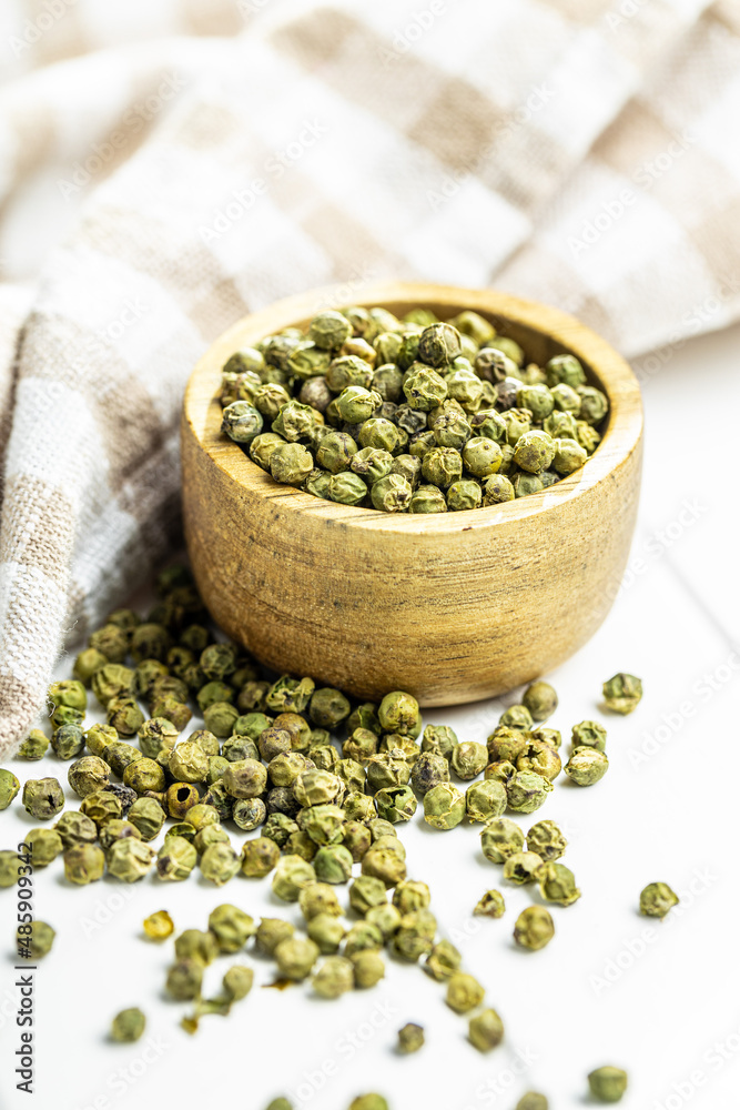 Canvas Prints dried green peppercorn. dry green pepper spice in bowl on white table.