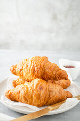 Breakfast with Croissants and strawberry jam.