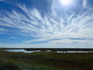 Clouds over the salt marsh on the causeway to Jekyll Island, Georgia, a popular slow travel destination.