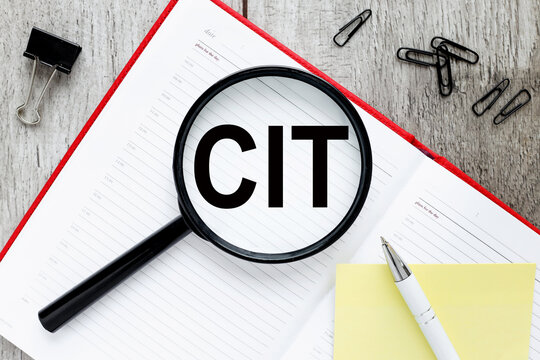 CIT. magnifier on red notepad text on magnifier glass