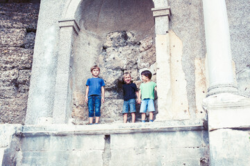 Fototapeta na wymiar little boy exploring ancient architecture, lifestyle people on summer vacation