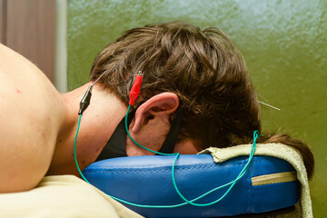 Relaxing muscle treatment with electric shock