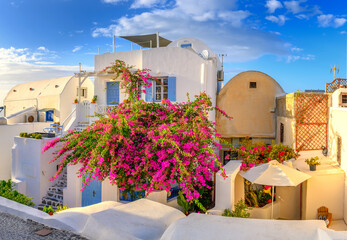 Traditional white architecture in Oia Village on Santorini Island, Greece. Scenic summer travel and vacation background.