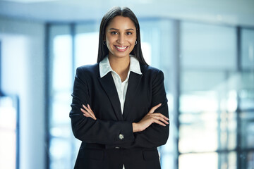 Im so happy I get to do this job. Shot of a young businesswoman in her office.