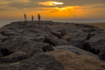 Fototapeta na wymiar Sunrise over a rocky seashore