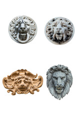 four plaster sculptures of lions heads isolated on white background