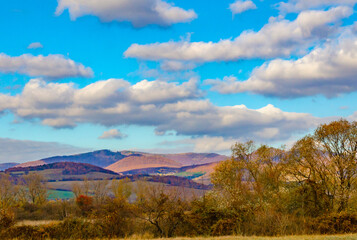 Autumn landscape with mountains and clouds