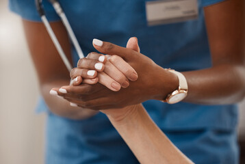 You dont have to look far to find support. Shot of a doctor holding hands with her patient during a...