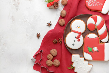 Tasty Christmas cookies on light background