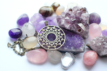 Silver round pendant and chain on semi-precious stones. Silver jewelry and druze of amethyst, rock...