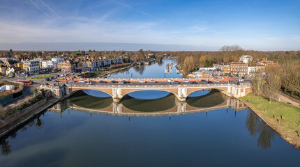 Fototapeta na wymiar Aerial view of Hampton Court Bridge on the River Thames.Hampton Court Bridge is a Grade II listed bridge in England approximately north–south between Hampton, London and East Molesey.