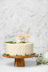 Fototapeta na wymiar Dessert stand with beautiful wedding cake on table