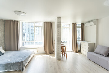Fototapeta na wymiar Interior of small modern apartment with white wall