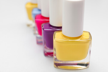 Set of nail polish bottles on light background