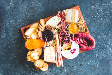 Assortment of tasty appetizers or antipasti. Charcuterie board.