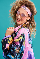 Inspired by the 80s. Studio shot of a beautiful young woman wearing a 80s outfit. © Emil L/peopleimages.com