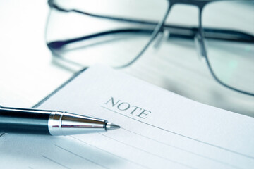 Fototapeta premium Management concept, pen over an agenda. Blue toned