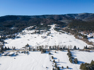 Fototapeta na wymiar Aerial winter view of Batak Reservoir covered with ice, Bulgaria