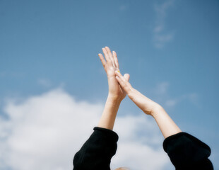 hands in sky