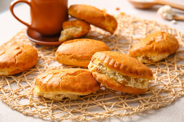 Tasty sochniki with cottage cheese on light background