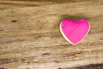 word love cast in homemade colored cookies on wooden table