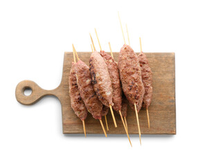 Wooden board of skewers with tasty lula kebab isolated on white background