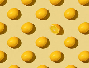 Pattern of Lemons on a yellow background - top view