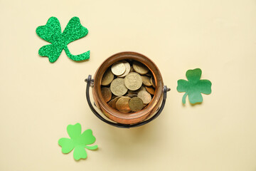 Leprechaun pot with golden coins and clover leaves on light background. St. Patrick's Day...