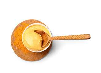 Bowl with turmeric mask and powder on white background