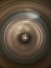Inside of a spinning washing machine tub looking from above