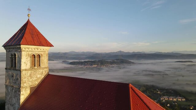 Drone shoot,moody green, green woods, clouds, sunrise , sunny day, woods, afternoon Europa SLOVENIJA, Ljubljana , , prodia, from back, church religion