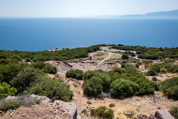 Fototapeta na wymiar Assos theater, ancient Greek archeological site, overlooking the Aegean Sea in Turkey. Assos is famous for In the Academy of Assos, where Aristotle became a chief to a group of philosophers. 