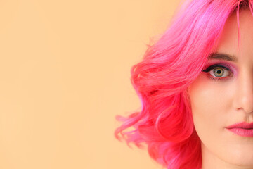 Stylish woman with bright hair on color background, closeup