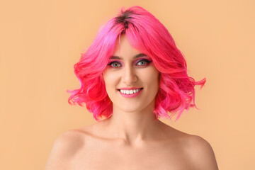 Stylish woman with bright hair on color background
