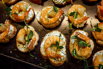 Selection of tasty bruschetta with salmon and shrimp.