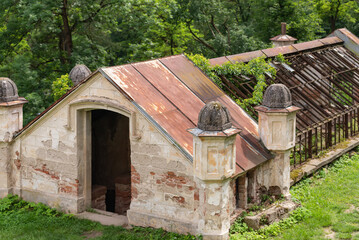 Ruins of an ancient greenhouse. The skeleton of an old heated greenhouse for growing vegetables.