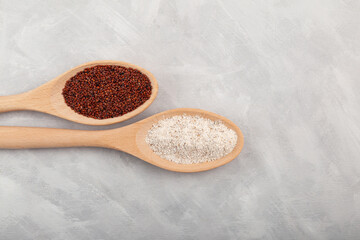 Ragi or Nachni, also known as finger millet and ragi coarse flour in wooden spoons, close-up. Top...