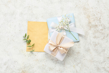 Blank greeting card for International Women's Day, gift boxes, eucalyptus branch and gypsophila...