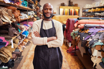 Lifes about not taking failures personally. Shot of a young man working at his job in a shop.